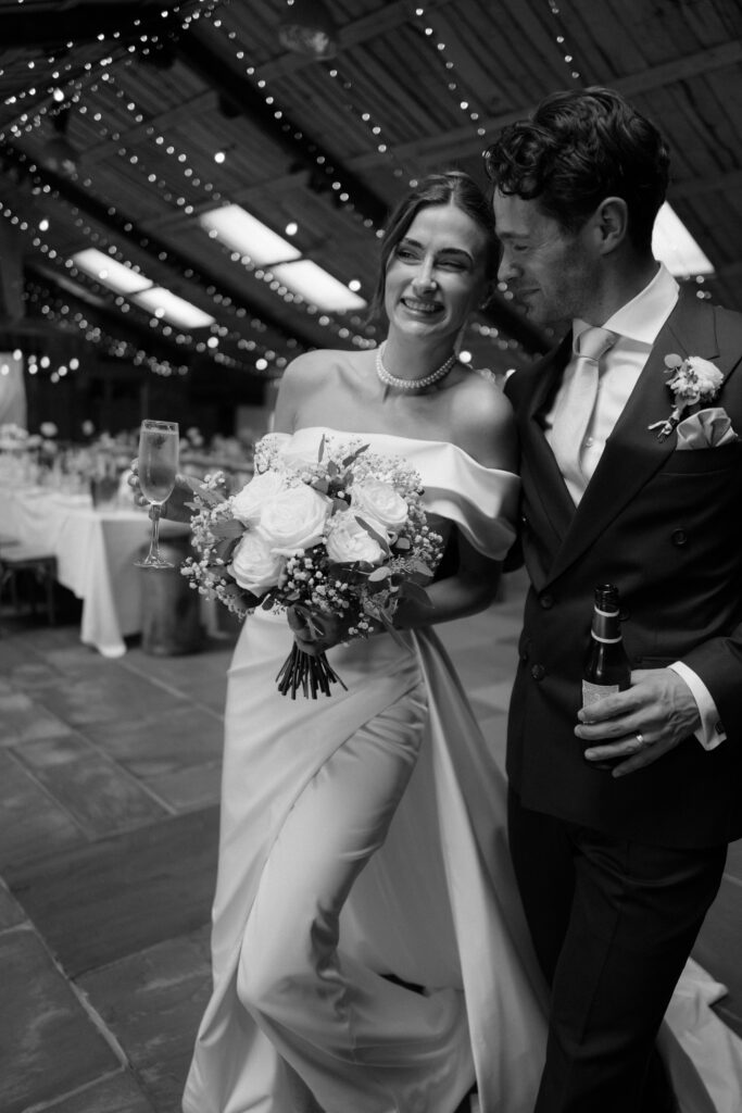 Smiling couple, flowers, Owen House Wedding Barn